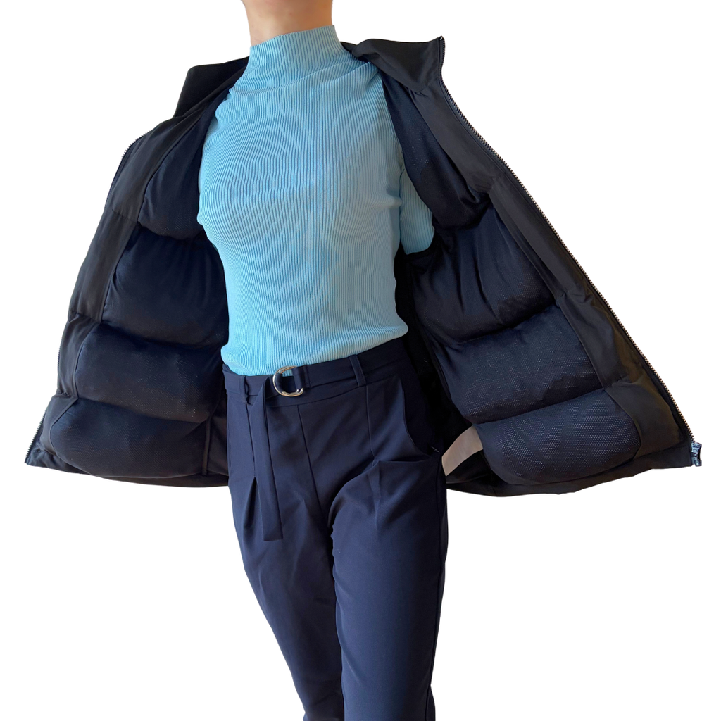 Model holding the Cabin Vest open to show the padded inner pockets